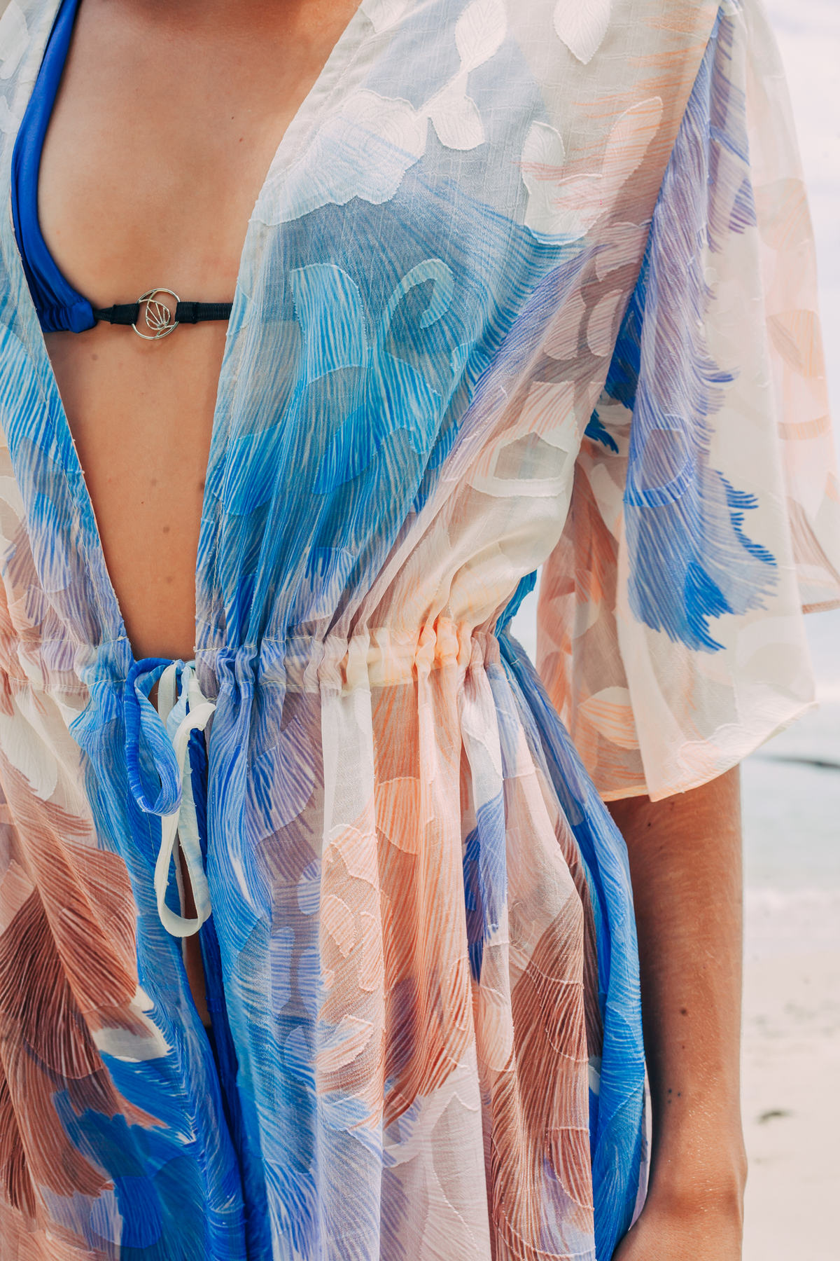 Close-up of Aveline Mini Tunic showing sheer fabric and blue print