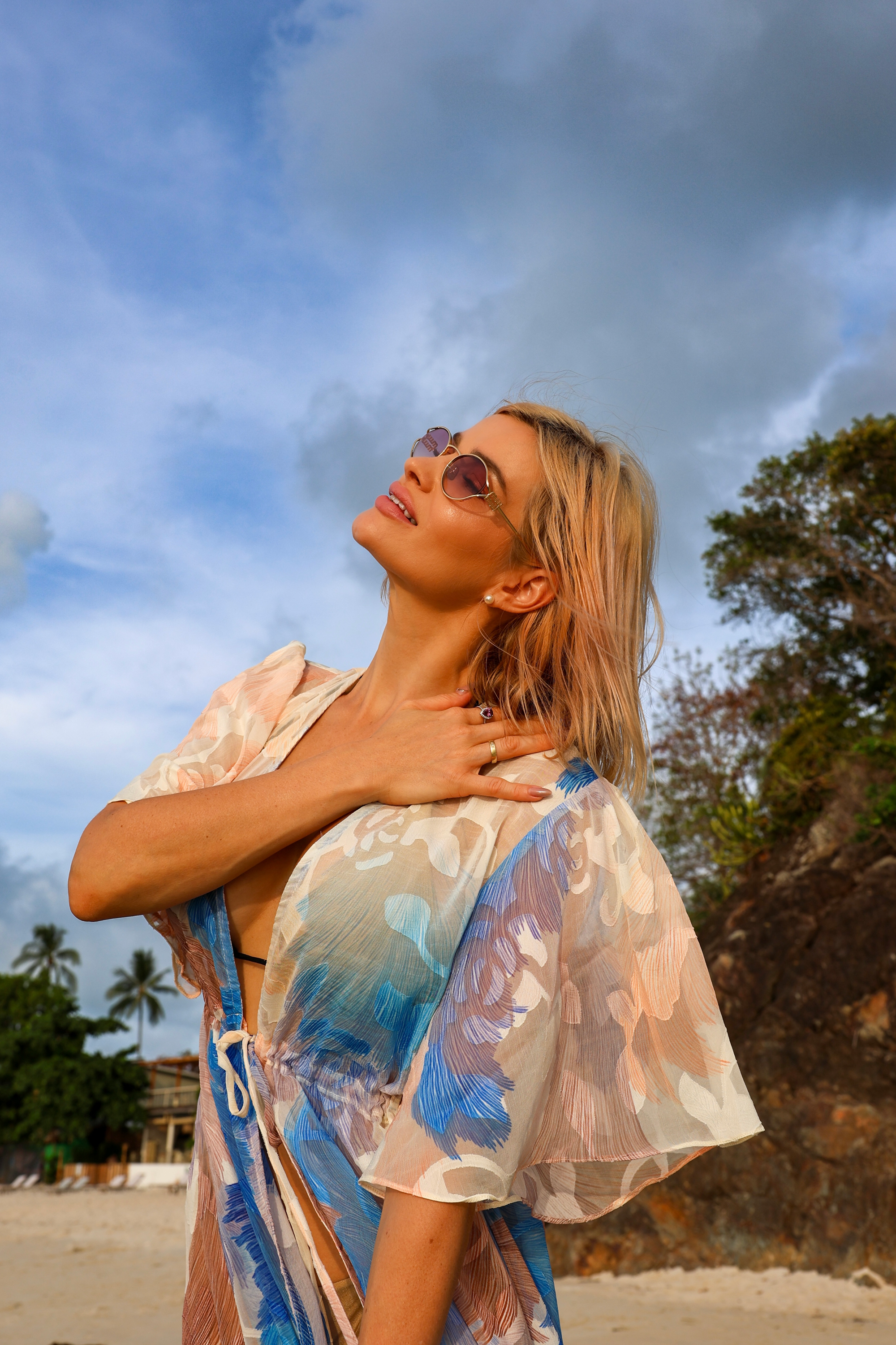 Close-up of the INNEVIA Aveline Mini Tunic featuring an exclusive artistic print, airy flutter sleeves and lightweight semi-sheer fabric for elegant resort styling.