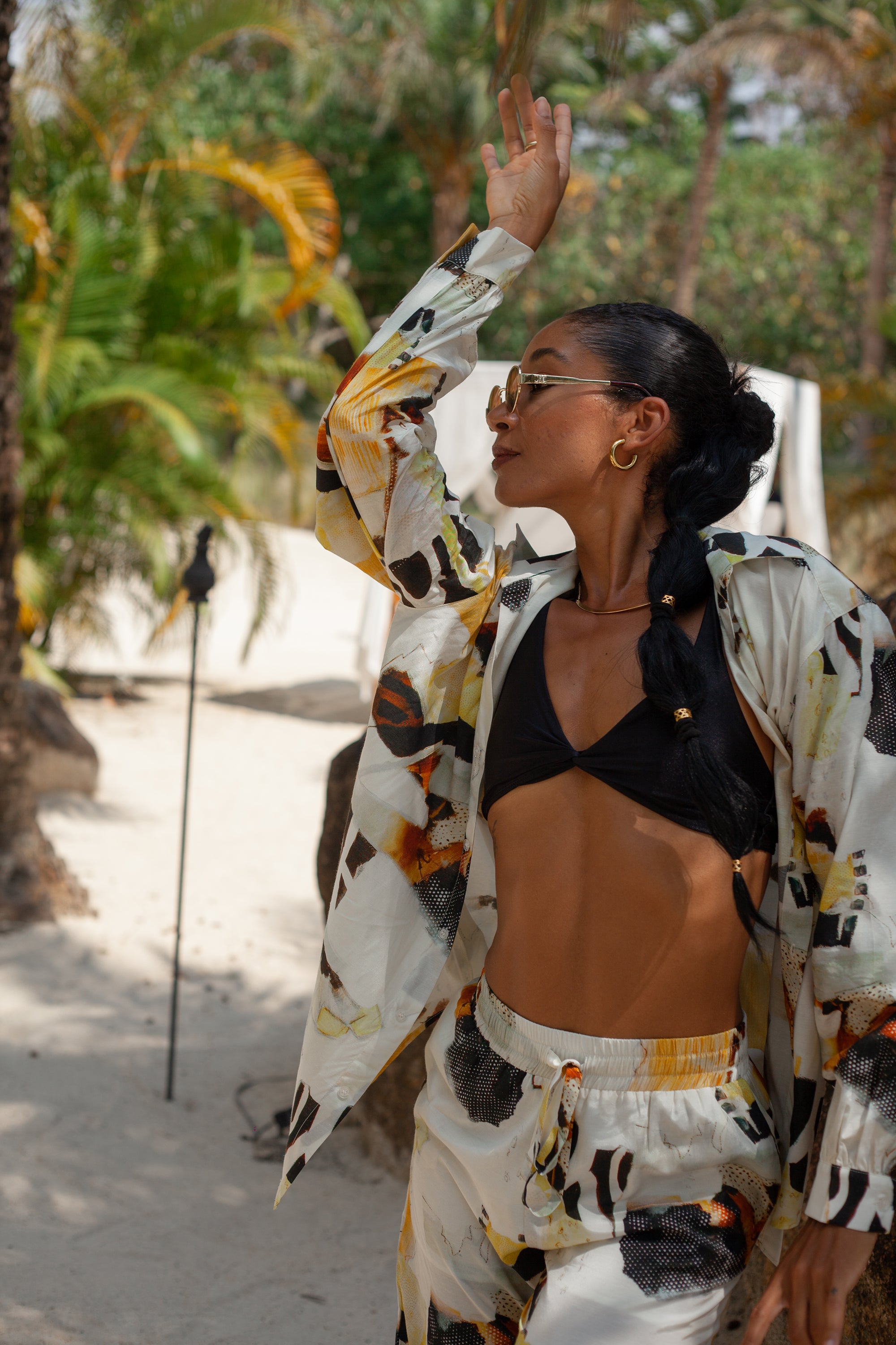 Solea shirt styled open in resort setting, effortless summer look