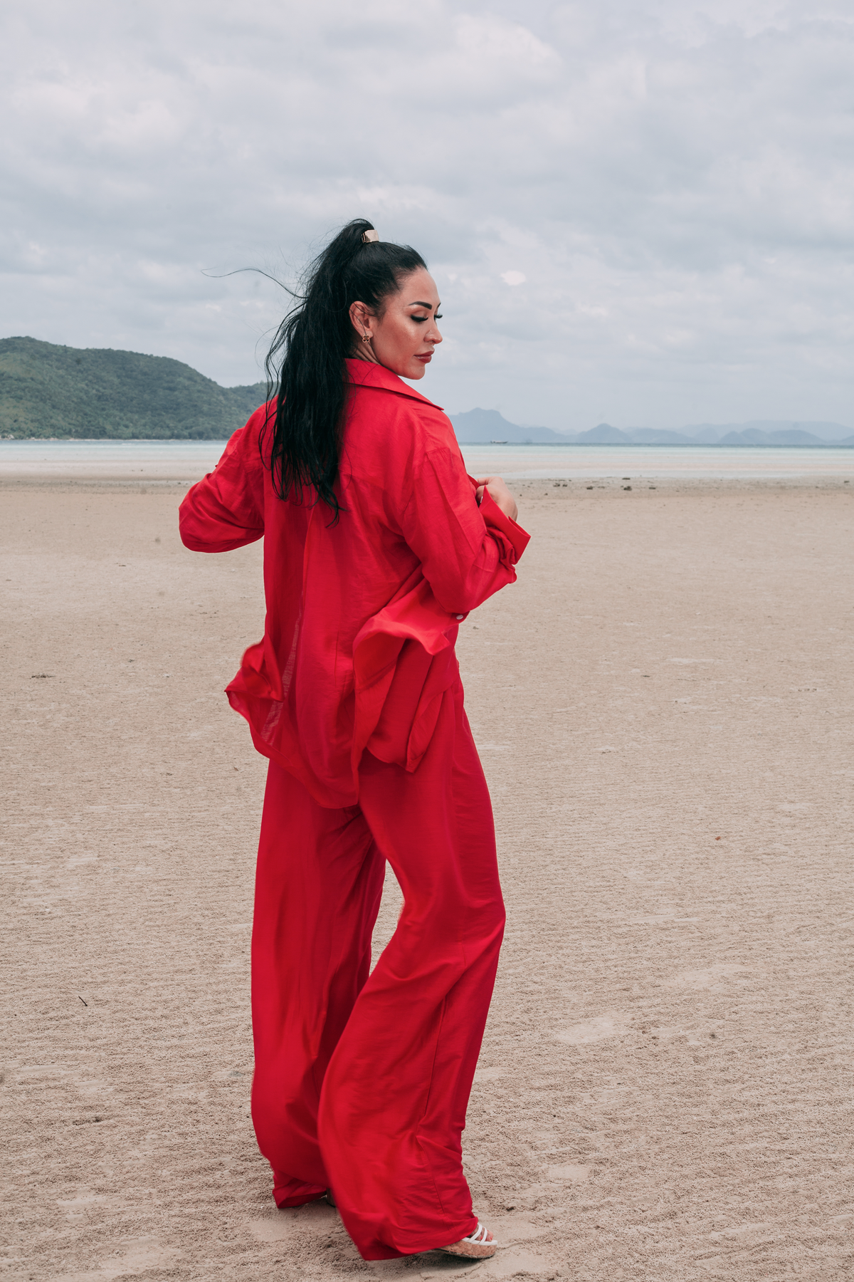Carmine Fluid Pants by INNEVIA styled with the coordinating deep red shirt for an effortless seaside resort look