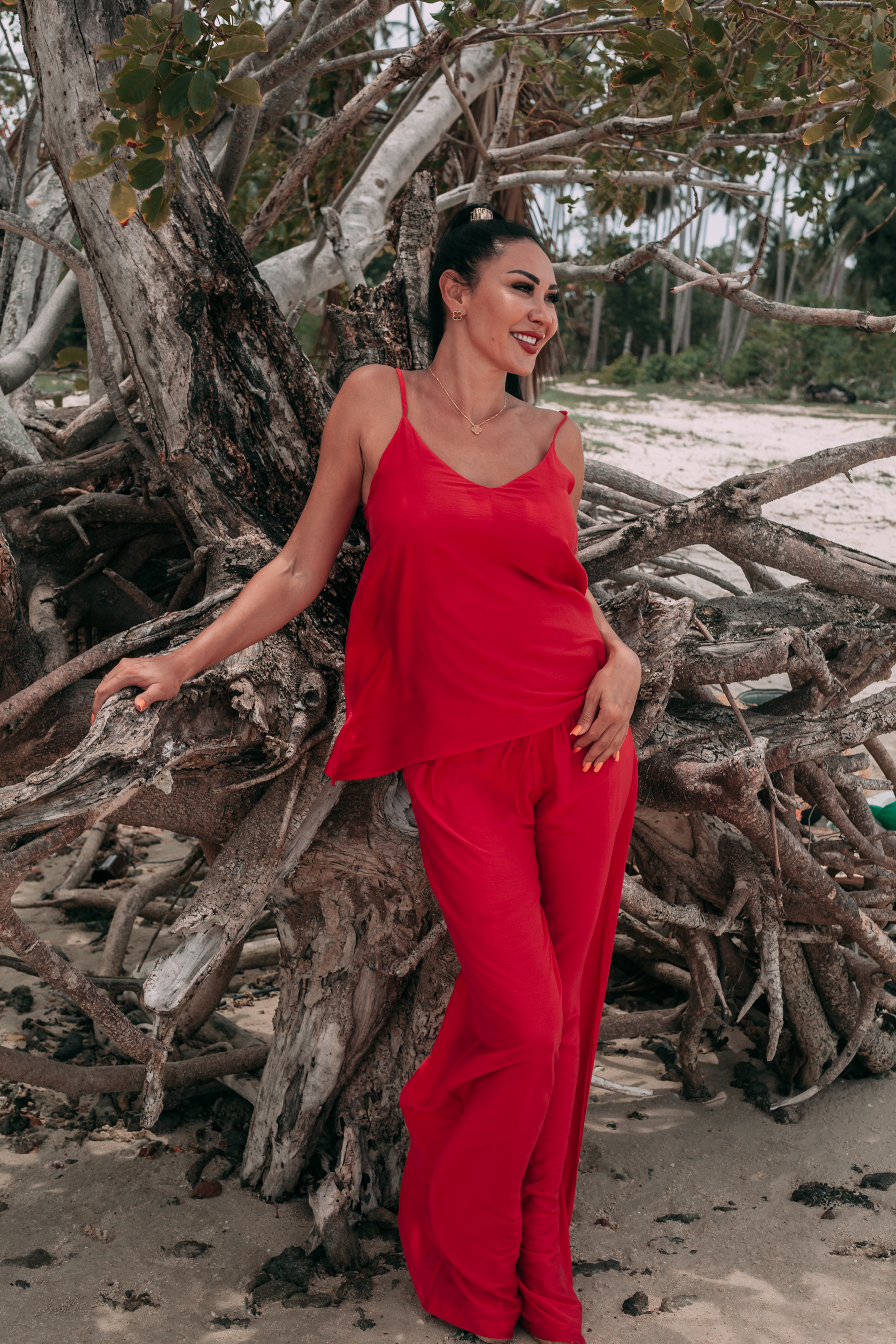 Carmine red asymmetric top and wide-leg trousers in a lightweight silk-blend fabric by INNEVIA