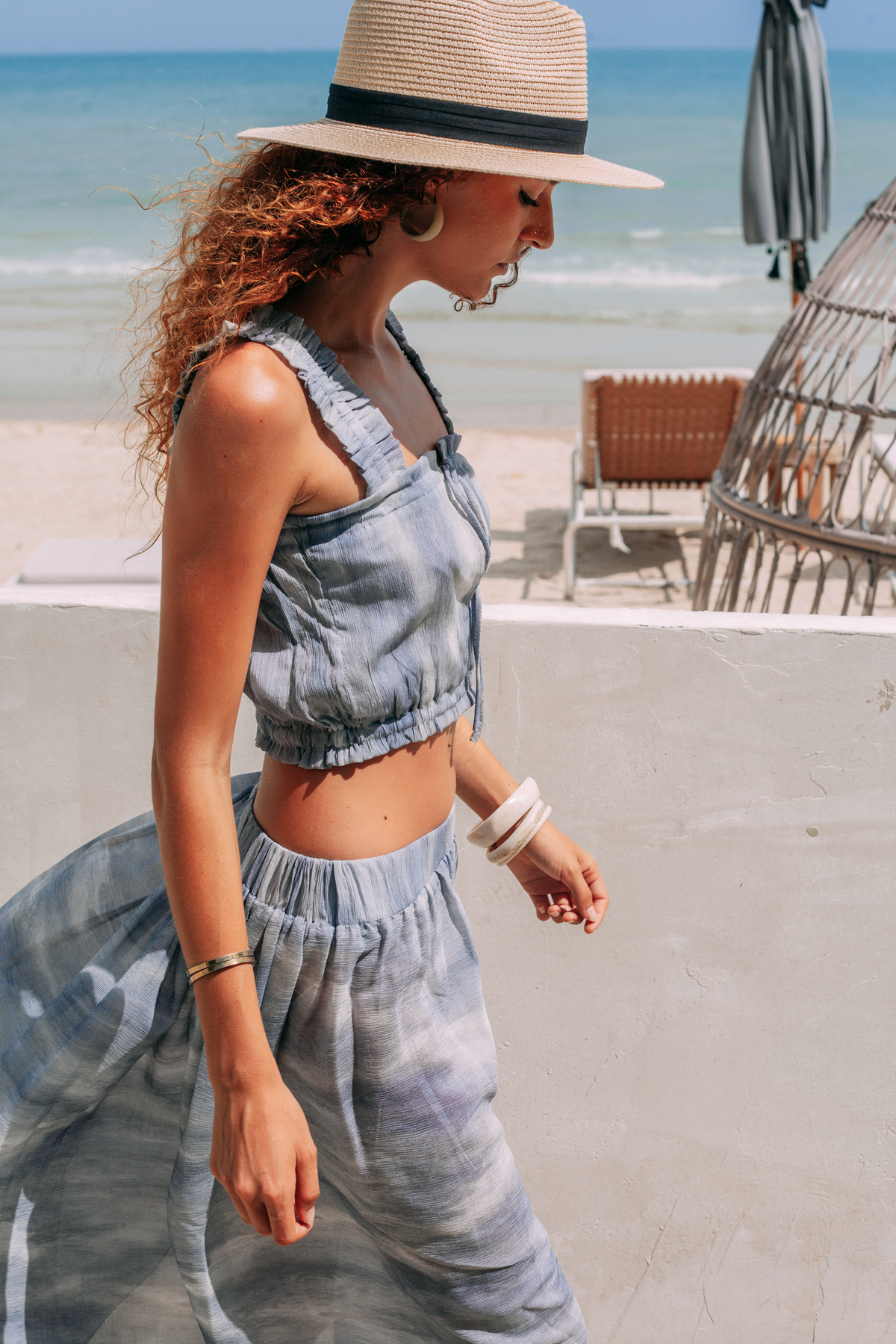 Elara luxury resort wear set featuring a cropped top and draped wrap maxi skirt