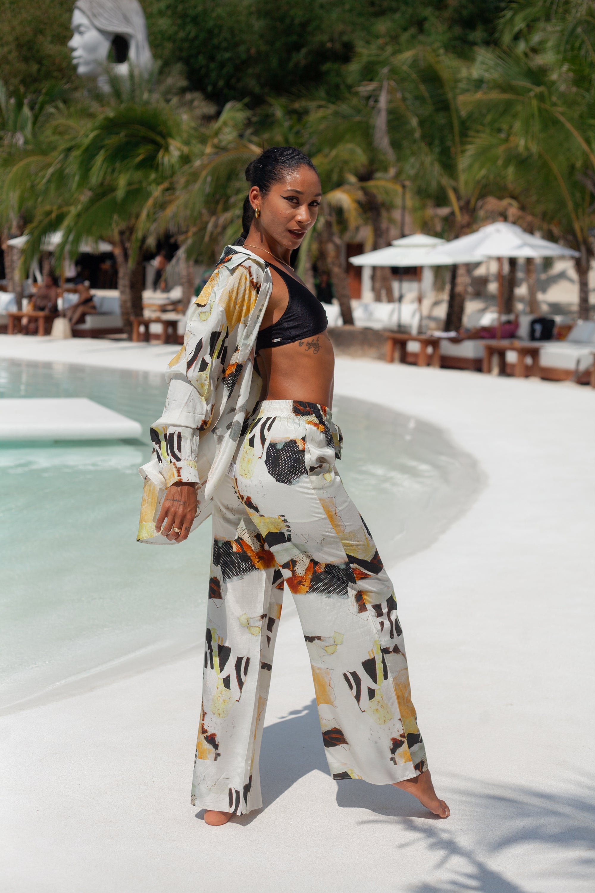Solea printed trousers in motion, lightweight fabric flow