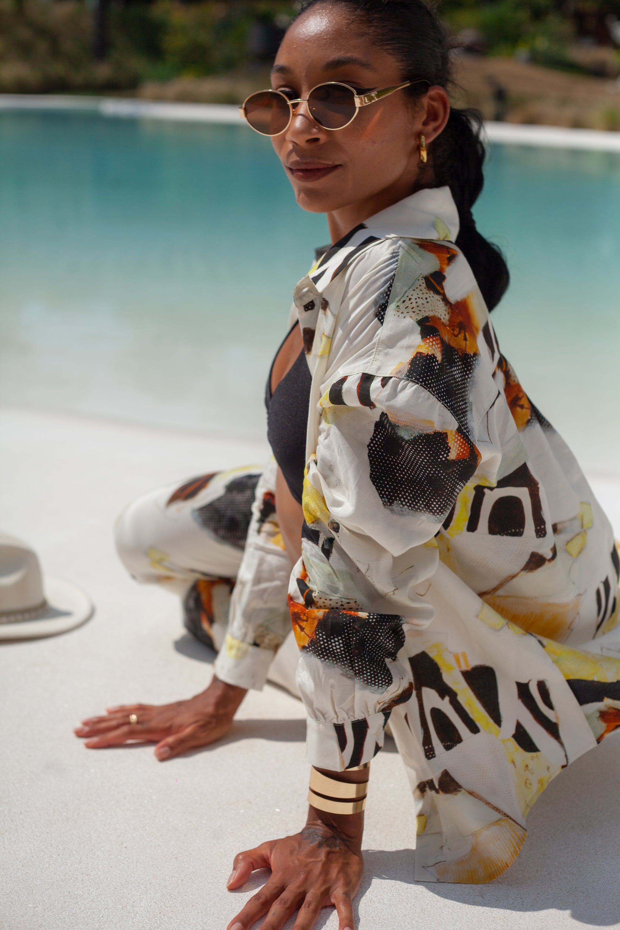 Solea shirt side view styled over bikini, relaxed fit and fluid fabric